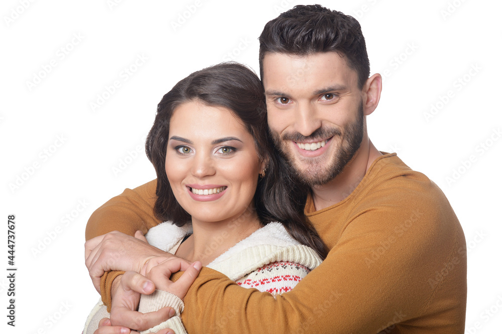 Portrait of happy young couple smiling and hugging Portrait of happy young couple smiling and hugging