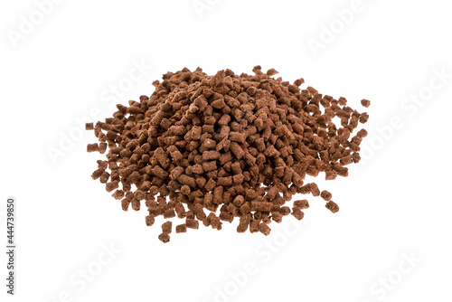 Brown Food for fishing isolated on a white background. Pile of granules to feed carp. Granule fish food. Food for fish isolated on white.