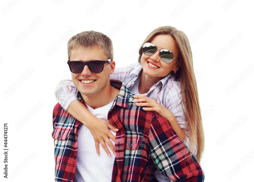 Portrait close up of happy smiling young couple hugging together, man giving piggyback ride to woman wearing a sunglasses isolated on white background Portrait close up of happy smiling young couple hugging together, man giving piggyback ride to woman wearing a sunglasses isolated on white background