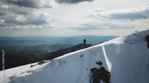 Views from Dumbier Mountain in Low Tatras mountains. Late spring, snow-capped mountains. Tourism and hiking NAPANT National Park travel destination. Aerial footage. photo