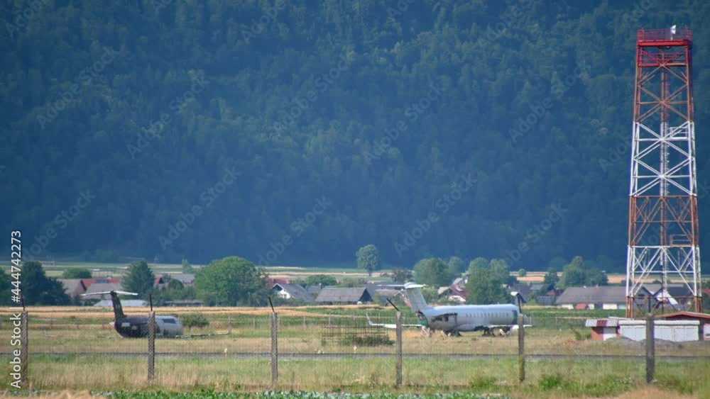 Abandoned airplanes and industrial radar for transmitting and receiving signals and monitoring takeoffs and landings. Ljubljana airport, Slovenia. Right pan Abandoned airplanes and industrial radar for transmitting and receiving signals and monitoring takeoffs and landings. Ljubljana airport, Slovenia. Right pan