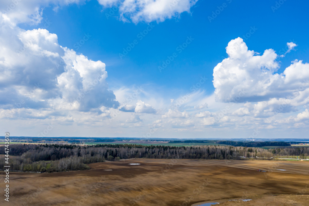 Aerial view of agricultural landscape with fields in spring season.