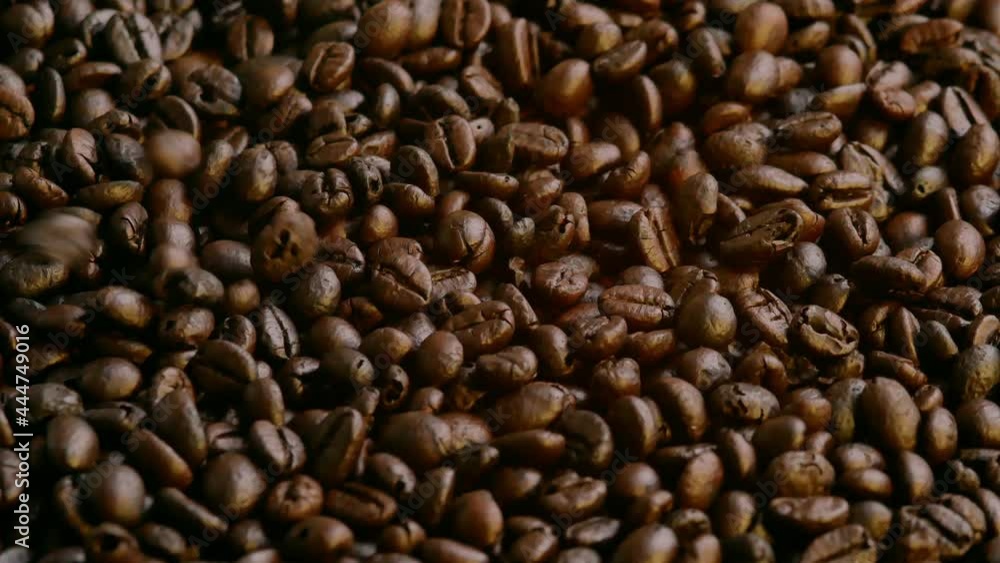 Roasted Coffee Beans falling is background. Organic coffee seeds. Roasted Coffee Beans falling is background. Organic coffee seeds.