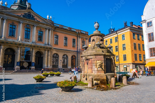 Stockholm Sweden - July 1 2021: Colourful historic buildings and houses in Gamla Stan, Main S. Romantic medieval city centre alleys. Popular tourist destination in Scandinavia on a sunny day.