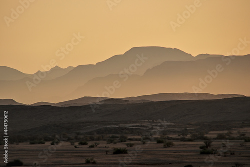 incredible view of mountains in golden light during sunset