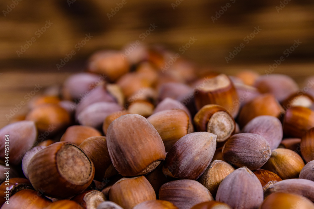 Pile of the hazelnuts on wooden table Pile of the hazelnuts on wooden table