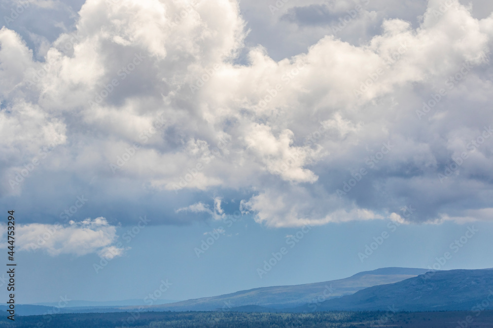 Storm clouds over a mountain landscape Storm clouds over a mountain landscape