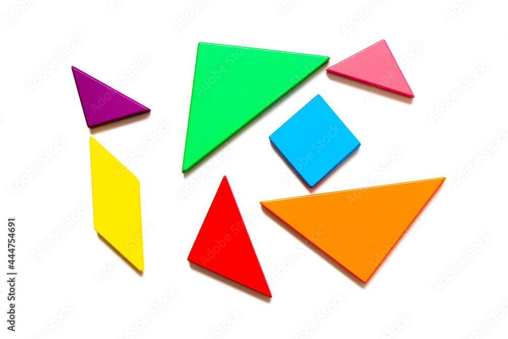 Color wood tangram puzzle in geometric shape wait to build on white background Color wood tangram puzzle in geometric shape wait to build on white background