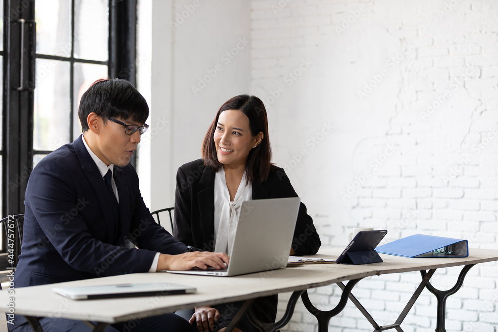 businessman and businesswoman talking about work or project in office businessman and businesswoman talking about work or project in office