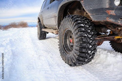 Tires for winter riding in the mountains. Offroad machine. Traveling in the snow