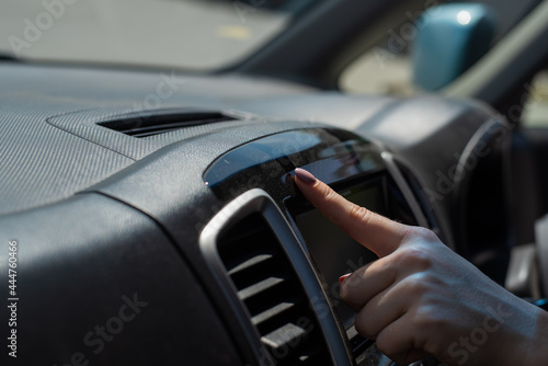 Wipe dust off car dashboard with finger.