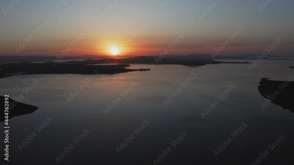 Sunrise over the Sea of Japan. Calm sea in calm, shining reflections Sunrise over the Sea of Japan. Calm sea in calm, shining reflections