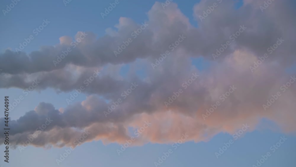 White smoke from factory smokestack, chimney against blue sunset sky - wide angle view, vertical shot. Environmental pollution, ecology problems, industrial emissions, manufacturing concept White smoke from factory smokestack, chimney against blue sunset sky - wide angle view, vertical shot. Environmental pollution, ecology problems, industrial emissions, manufacturing concept