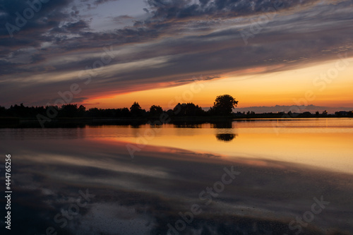 Reflection of clouds in the water after sunset © darekb22