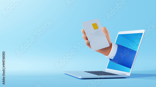 3d illustration. Cartoon character hand sticking out the laptop screen, holding plastic card with chip. Internet business clip art isolated on blue background. Online service application photo