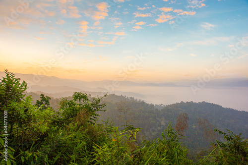 mountains and fog in the morning,Beautiful sunshine at misty morning mountains