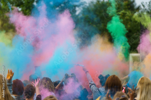 Colorful powder thrown into the air by the crowd