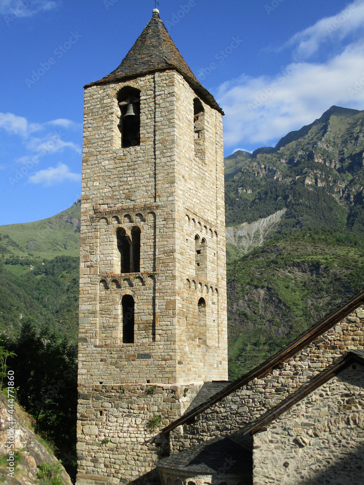UNESCO World Heritage.
First Romanesque church of Sant Joan in the village of Boí. (11-12 century). View of the bell tower. Valley of Boi. Spain.