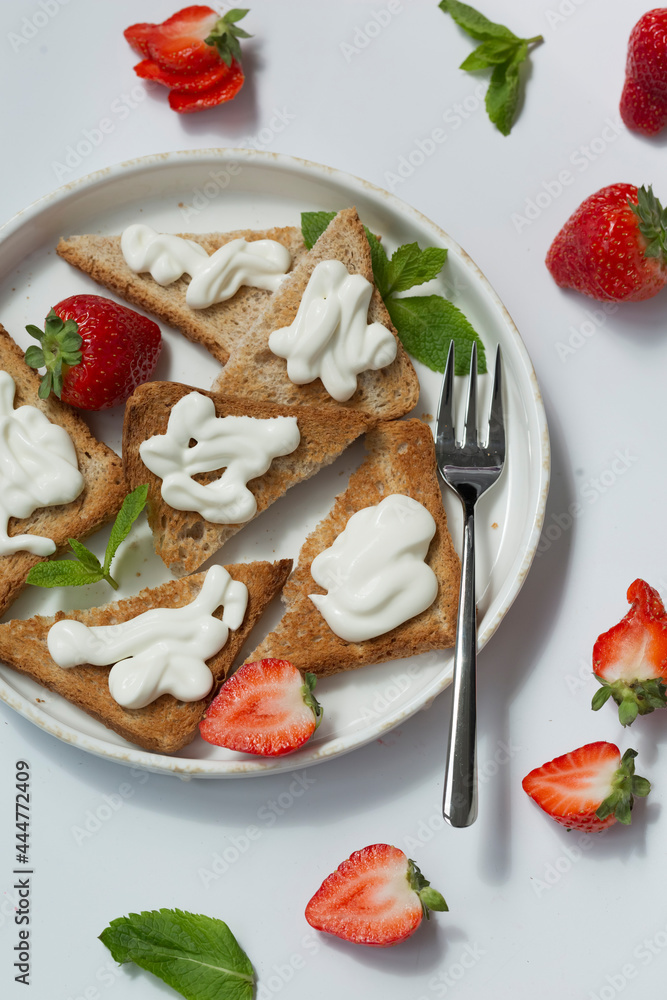 Healthy food breakfast strawberry toast with butter cream Healthy food breakfast strawberry toast with butter cream