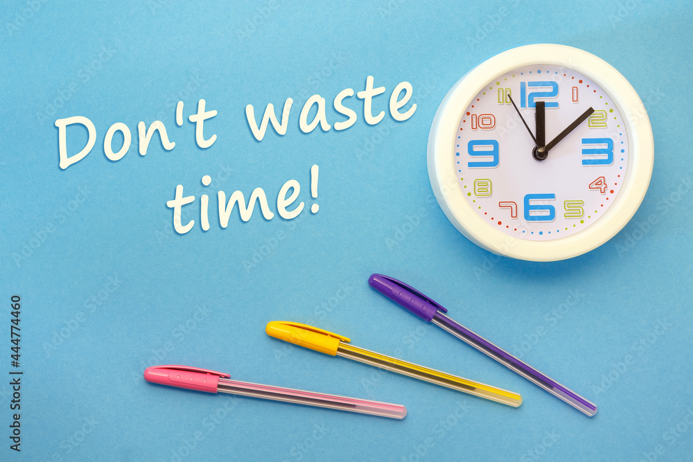 Don't waste time - lettering on a blue background and clock Don't waste time - lettering on a blue background and clock