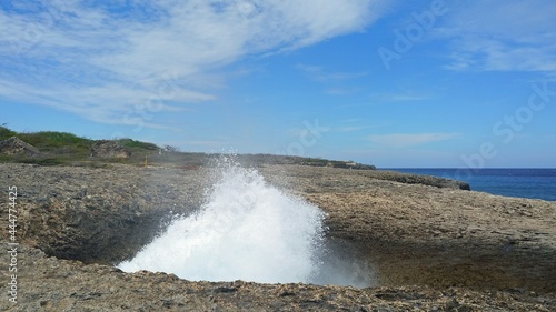 huge water burst at the natural Watamula hole on the rugged shoreline along North shore of Westpunt, Curacao