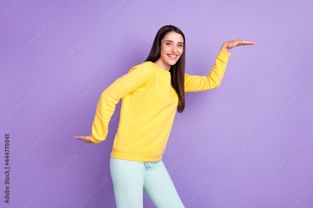 Photo of positive cheerful charming young woman dance egyptian good mood isolated on purple color background Photo of positive cheerful charming young woman dance egyptian good mood isolated on purple color background