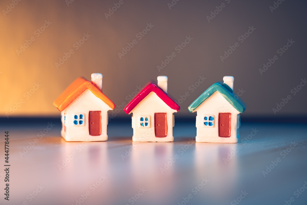 Closeup colorful miniature house using as property real estate and family concept Closeup colorful miniature house using as property real estate and family concept