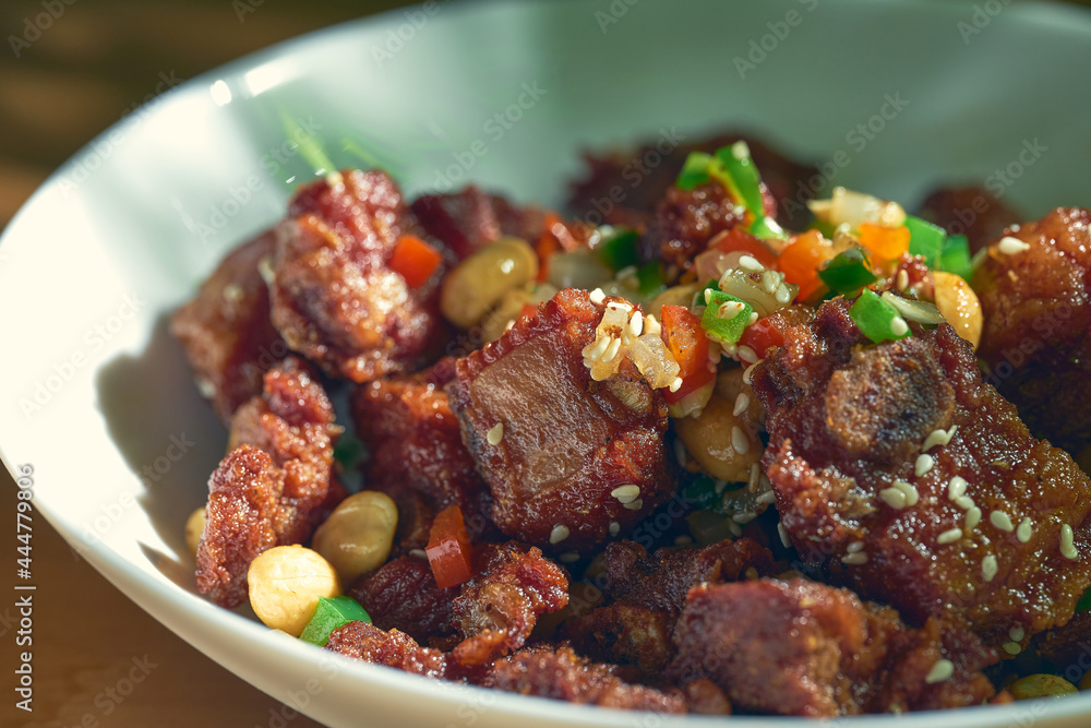 Grilled BBQ pork ribs with sesame seeds and peanuts. Chinese recipe and cuisine. Grilled BBQ pork ribs with sesame seeds and peanuts. Chinese recipe and cuisine.