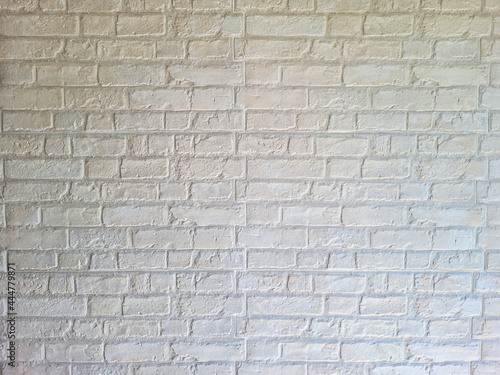 Modern house walls without plaster to show the cement and brick inside painted white.