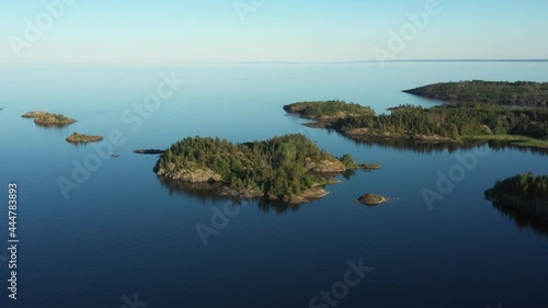 Aerial view on the lake and Islands with rocky coastline and forest in Karelia. Drone view on the beautiful Ladoga lake. Skerriy in the northwestern part of the Lake Ladoga photo