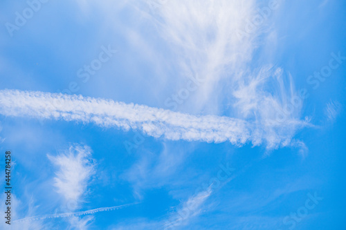 Photography Contrails in the beautiful sky of sahlenburg, cuxhaven at a warm summer day with