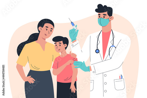 AA male doctor in a mask and gloves makes a vaccine to a child patient