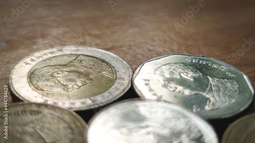 Double exposure of light and stack of coins for finance and banking concept, coins stacked background, copy space for texting.