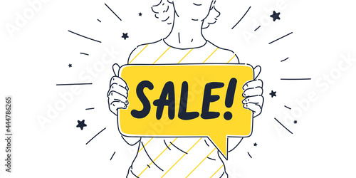 The girl is holding a poster in her hands. A young woman encourages you to shop at a sale in a store.
