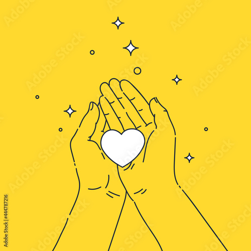 A persons hands hold a heart symbol in their palms. A hand gesture.