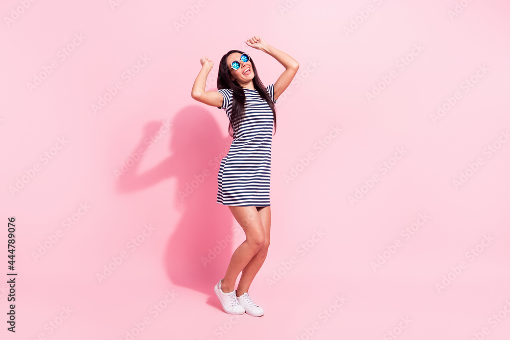 Full length body size view of lovely cheerful woman dancing having fun summertime isolated over pink pastel color background Full length body size view of lovely cheerful woman dancing having fun summertime isolated over pink pastel color background