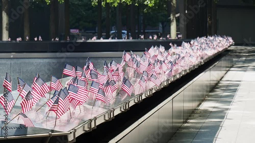 Close up shot of many America flags on the 911 Memorial South Pool photo