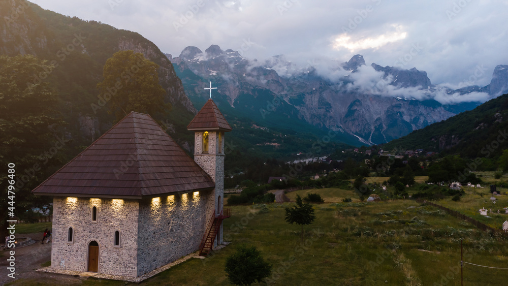 A Catholic Church in the village of Theth in Prokletije in the Acursed Mountains of Albania. The community is at the centre of the Theth National Park, an area of outstanding natural beauty. A Catholic Church in the village of Theth in Prokletije in the Acursed Mountains of Albania. The community is at the centre of the Theth National Park, an area of outstanding natural beauty.
