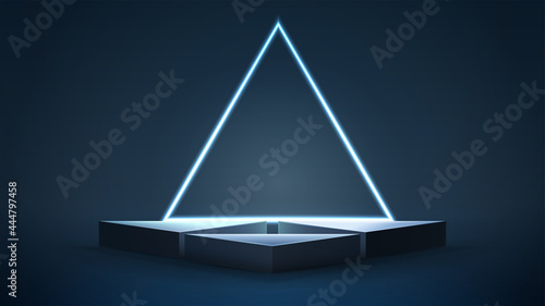 Empty blue triangular podiums with neon triangular frame on dark background