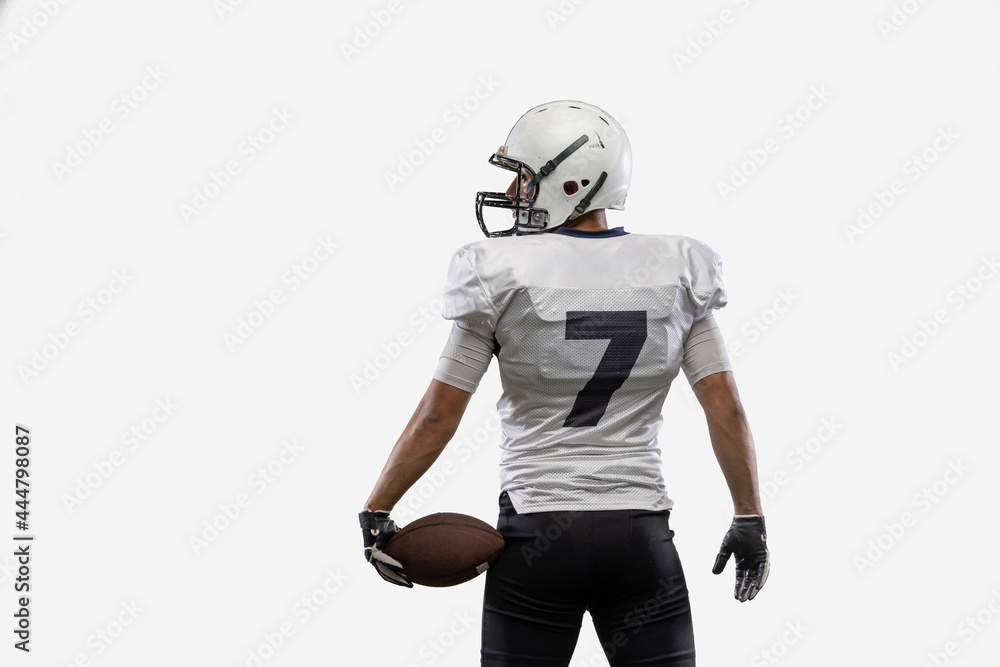 Close-up American football player with ball isolated on white studio background. Back view Close-up American football player with ball isolated on white studio background. Back view