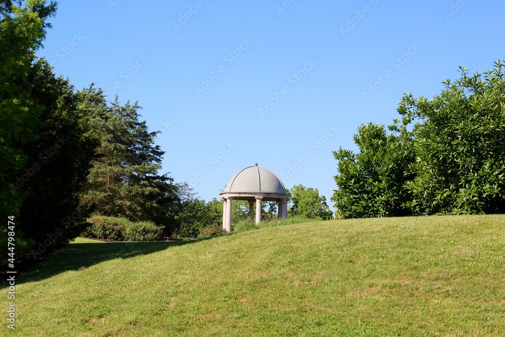 The top of the dome cement gazebo in the park.