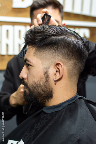 Man getting a haircut in a barbershop