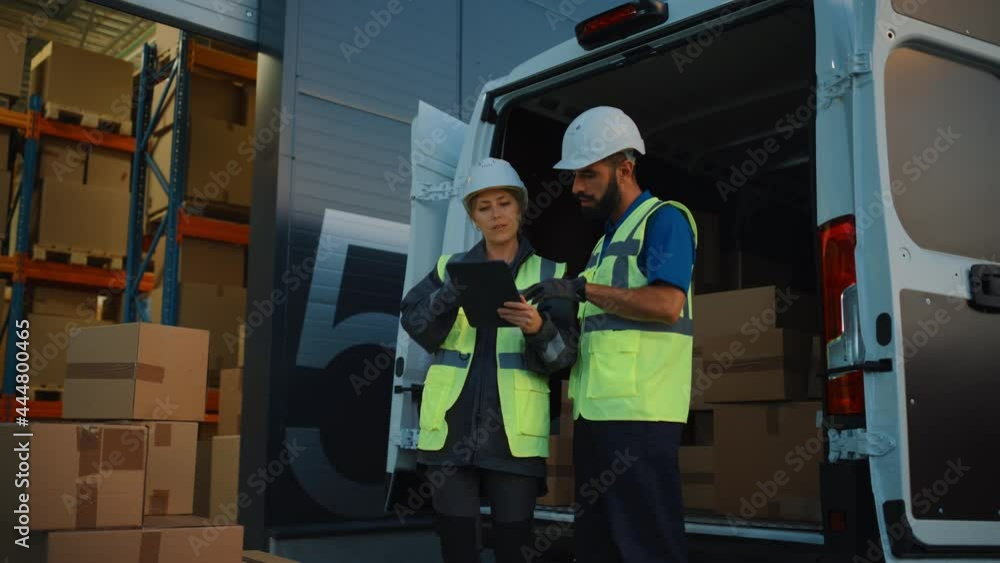 Outside of Logistics Distributions Warehouse With Inventory Manager Using Tablet Computer, talking to Worker Loading Delivery Truck with Cardboard Boxes. Online Orders, Purchases, E-Commerce Goods Outside of Logistics Distributions Warehouse With Inventory Manager Using Tablet Computer, talking to Worker Loading Delivery Truck with Cardboard Boxes. Online Orders, Purchases, E-Commerce Goods