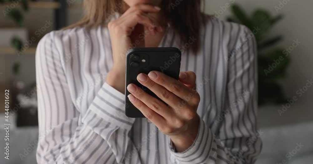 Close up female hands holding modern electronic gadget cellphone, tech addicted young woman spending time online, using telephone applications, shopping in internet store or communicating distantly. Close up female hands holding modern electronic gadget cellphone, tech addicted young woman spending time online, using telephone applications, shopping in internet store or communicating distantly.