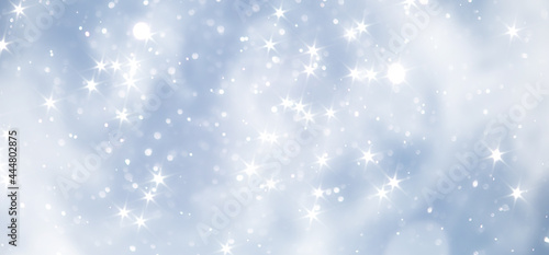 blue snowfall bokeh background, abstract snowflake background on blurred abstract blue © alexkich