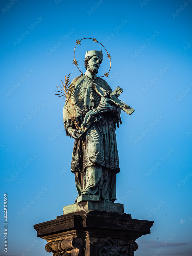 Bronze Statue of Saint John of Nepomuk or Jan Nepomucky on Charles Bridge in Prague, Czech Republic Bronze Statue of Saint John of Nepomuk or Jan Nepomucky on Charles Bridge in Prague, Czech Republic