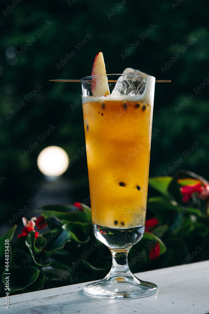 Refreshing summer cocktail with peach and passion fruit Refreshing summer cocktail with peach and passion fruit