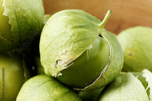 Close-up view of tomatillo Mexican husk tomato fresh green fruits. photo