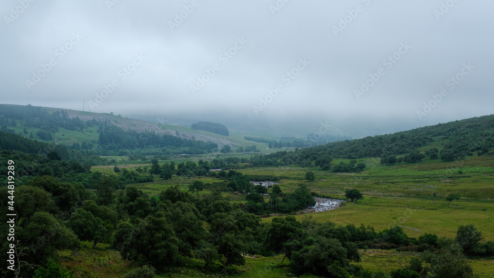 Fototapeta premium The River Brora in Strath Brora in summer on a misty day