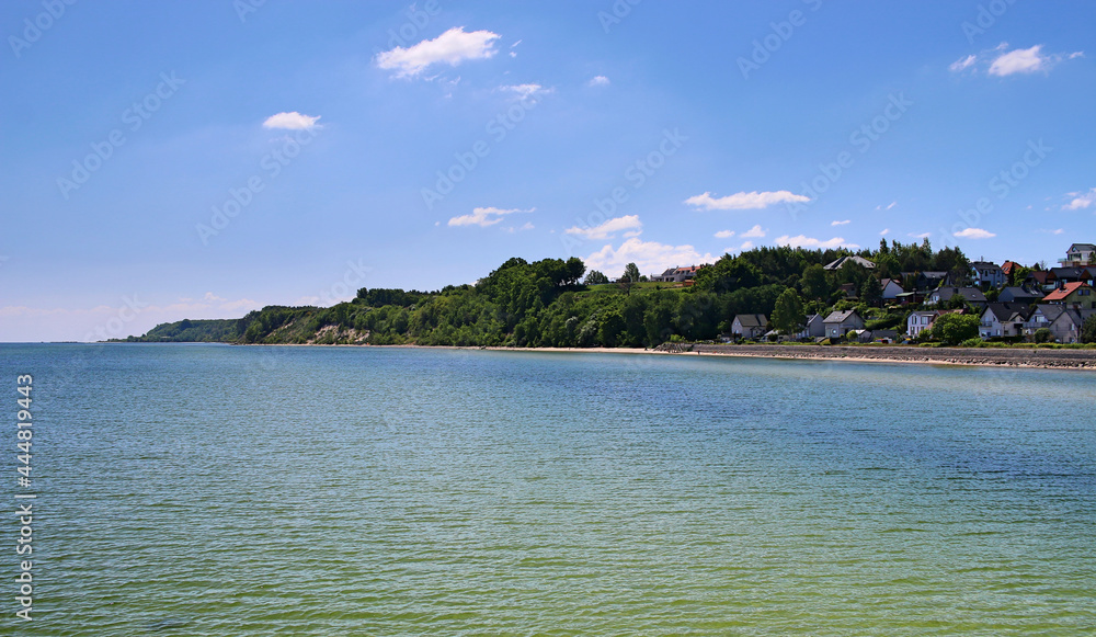 View from the Baltic Sea on the coast and the beach in Mechelinki in Pomerania. 